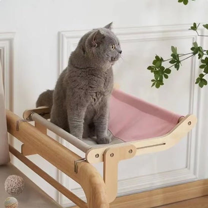 Hamac pour chat CatNap rose, modèle solide, installé au bord du lit